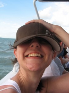 Holding her hat
